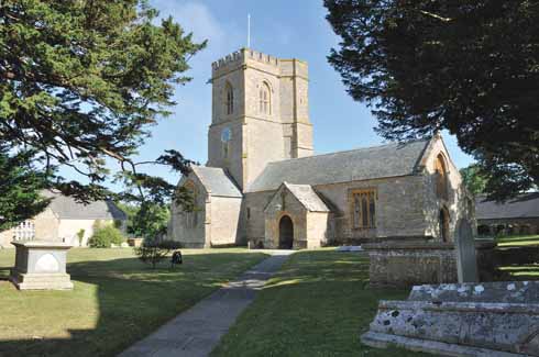  The parish church of St Mary the Virgin showing the clock that was brought from old Christ’s Hospital school in London. The church’s south aisle was restored in 1897 with the addition of ‘Arts and Crafts’ glasswork. 
