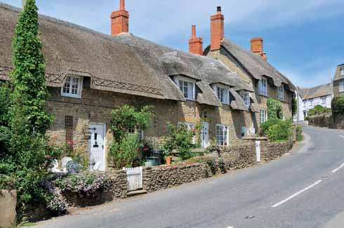 According to Treves: ‘The village is exceedingly pretty, possessing many delightful old houses and cottages with thatched roofs.’ This once accurate description is today less appropriate thanks to some undistinguished new building, and to the number of static caravans in the area.