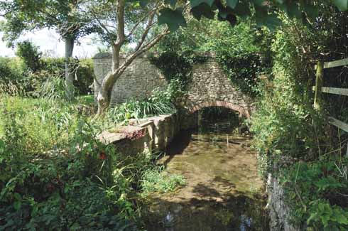 Reflecting the industrial past of the village, the mill stream is but one of a number of watercourses running through Burton, which originally takes its name from the River Bride (it was known as Bridetone in Norman times), while Bradstock comes from the Abbey of Bradenstoke in Wiltshire which held the manor from the 13th century