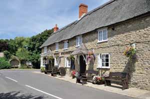 Burton Bradstock still keeps the spirit of a village, with its two pubs, post office and shop and school. The reason for the pub to share its emblem with the Worshipful Company of Farriers is lost in the mists of time.