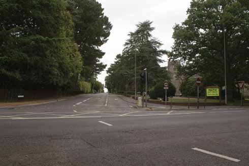 Looking from Dudsbury Avenue up Church Road. If the parish church of St Mary is hidden by the trees on the right of the older photograph, the date must be after 1933, but it is possible that the photograph was taken before the church was built. There is a double-decker bus cresting the hill in the older shot.