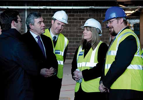 1010edLives2 Prime Minister Gordon Brown is shown progress on the building of the new Museum of Liverpool by Jon Murden (in the blue helmet)
