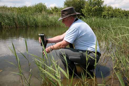 Nick Tomlinson sets up one of the remote cameras which have already captured some fascinating footage that can be viewed in the visitor centre