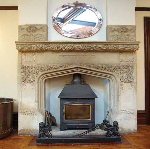 The striking fireplace in the main hall has ornate decoration, a Sanskrit inscription and the date ‘1902’