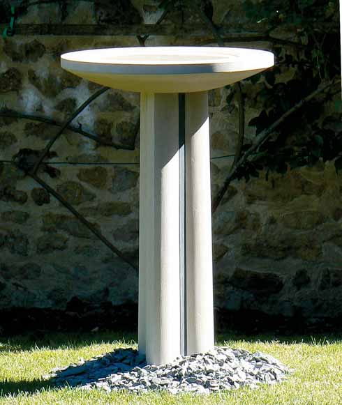 An elegant birdbath of Portland stone and Cumbrian green slate