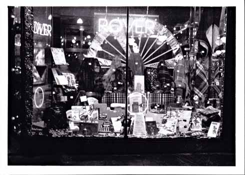 1110edSHOPPING6 Tilley’s Motor Showroom on South Street in the 1930s. The notice in the middle says ‘Christmas gifts’. These included rugs at the back and motoring things in the foreground.