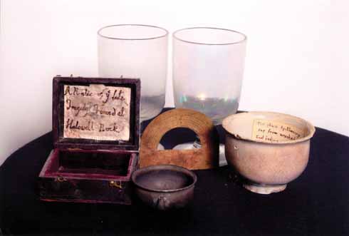 1210edHalsewell5 A collection of wreck relics: brass protractor from the ship's chart room, apothecary's cup and 18th-century wine glasses