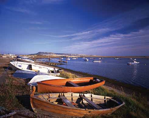 1210edTrump8 The bridge across the entrance to the Fleet lagoon at Small Mouth. The first bridge connecting Portland with mainland Dorset was not built until 1839, so when Anne Garland walks to Portland for a glimpse of HMS Victory with her beloved Robert on board, she has to be rowed across.