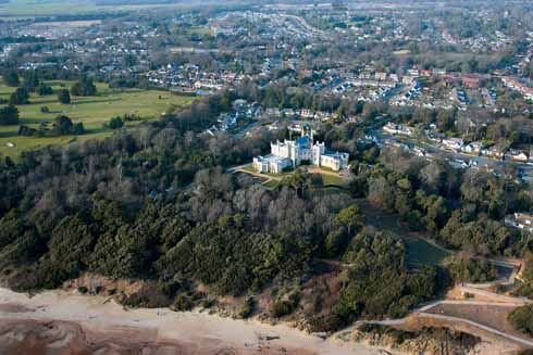 111edChristchurch2 A more distant view of Highcliffe showing its woodland, beach proximity and the more urban hinterland