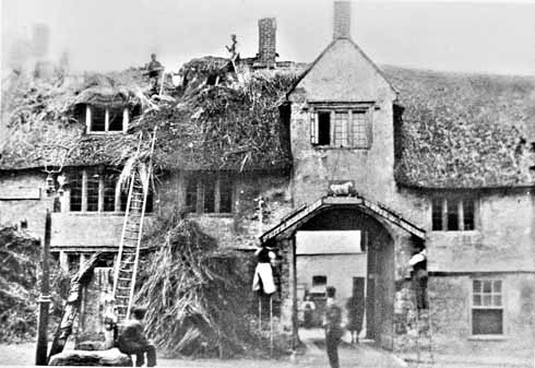 Demolition starts in September 1898 – pulling off the thatch and taking down the sign over the entrance archway. The thatch was five feet thick and consisted of at least seven layers.