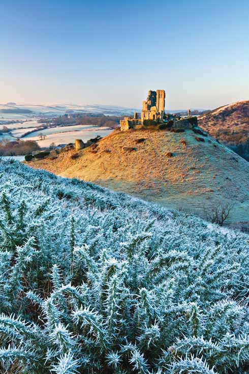BOV2_039_GE.tif The crumbling ruins of Corfe Castle are positioned in a strategic gap in the Purbeck Hills. Both East Hill and West Hill provide stunning views of the majestic Dorset landmark.