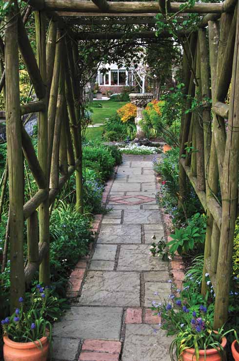 A rustic pergola links different areas