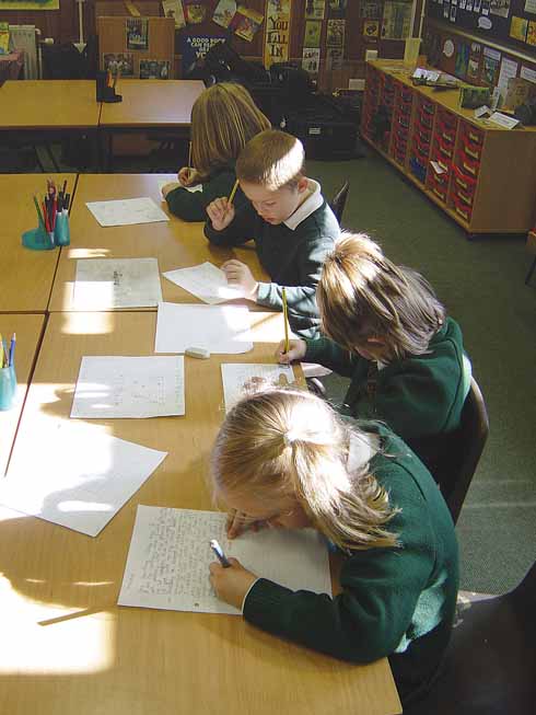 KS1 pupils at Writing Club, working on their own compositions.