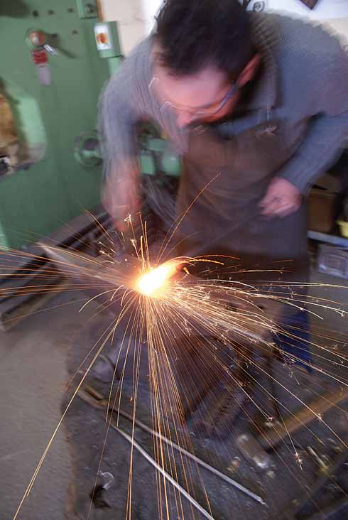 Adam Greenwell starts the process of creating a ram's-head fire companion set from a square-section piece of mild steel
