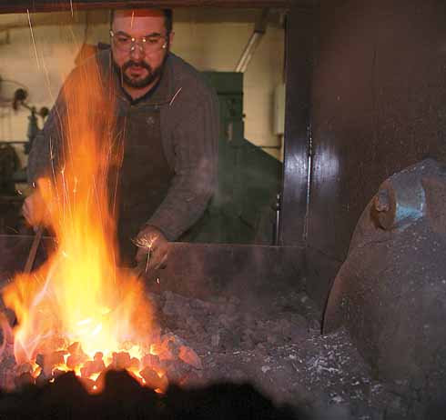 Before any of the five techniques of forging – drawing, shrinking, bending, upsetting, and punching – can be carried out, the metal needs to be heated to the correct temperature; this is determined by eye and experience