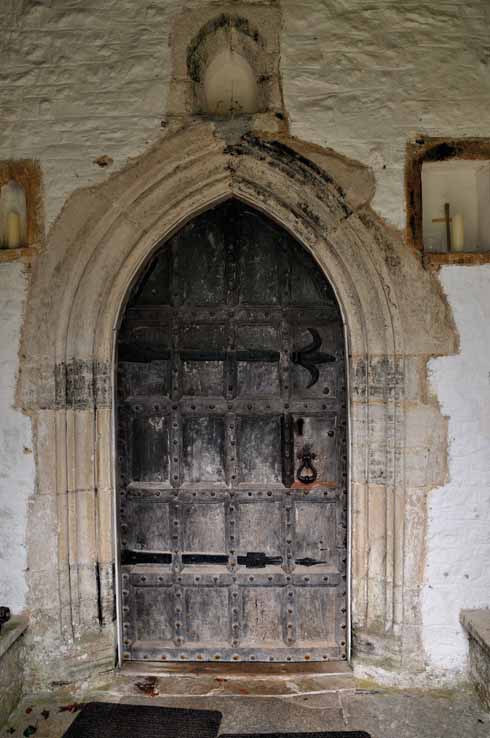 411edMaidenNewton7b According to church records, the wooden door in the South Porch dates from about 1600, but the hinges appear to be Norman. Inside this door is an ancient lock which, when it was taken off for greasing, was found to contain two inches of tallow.