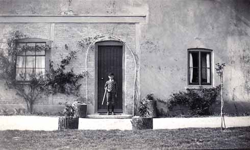 Don, aged 7, outside the family home at Arne