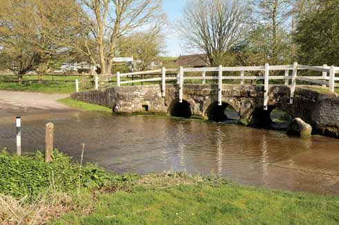 The ford at Tarrant Monkton is impassable when heavy rains have fallen; the distant finger post shows directions to six of the other seven  Tarrants (Crawford is missing) and back towards Monkton itself