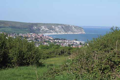Swanage and New Swanage with Ballard Point beyond and Bournemouth in the distance