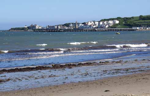 Swanage looking south to the pier head and sailing club, which are overlooked by modern developments