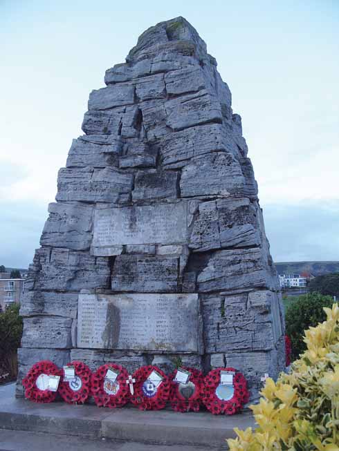 The Swanage war memorial with wreaths from those honouring the town's fallen from two world wars