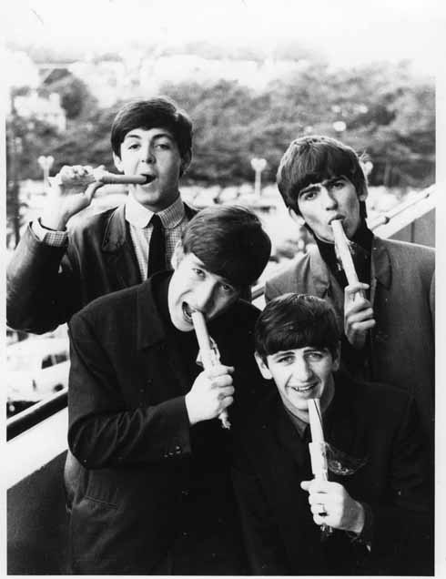 911edBournemouthBalcony - Aug 1963 Balcony – Aug 1963: Bournemouth Rock! Harry Taylor posed The Beatles on the first floor balcony of the Palace Court Hotel overlooking Westover Road in what is the only known set of photos of the Fab Four eating sticks of rock