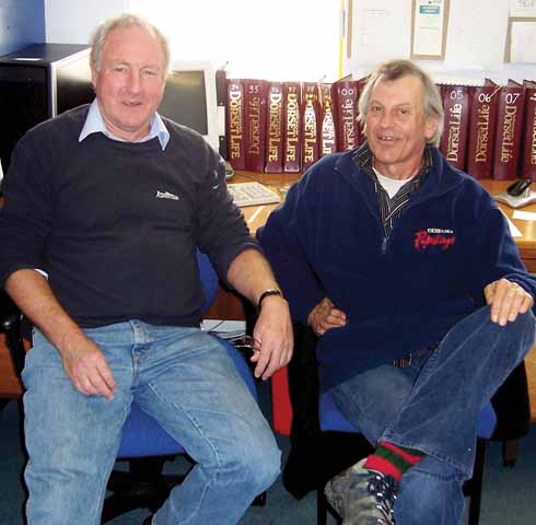 In the Dorset Life office: John Newth (left) and Rod Legg with walking boots