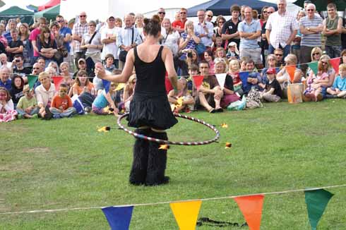 The circus skills demonstration and Punch and Judy show are ostensibly laid on for the children, but adults are equally enthusiastic