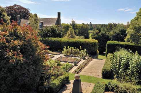 The beautifully tended garden (right) of the Manor House, Tolpuddle, a 1696 Grade II* listed building which was widely altered in the 18th century