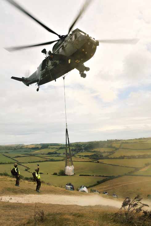 A helicopter takes away the unwanted stone chippings