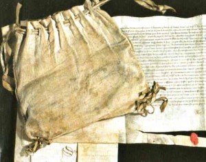 Sir Thomas Erpingham was steward of the royal household and commanded the archers at Agincourt. This is the indenture to serve the king during the Agincourt campaign and the leather pouch in which were kept documents relating to wage claims for his retinue.