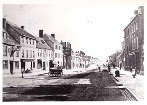 Looking down South Street (with the late, lamented Cross Keys pub on the left) one can see the cartwheel tracks on the road surface in this turn of the 20th century shot