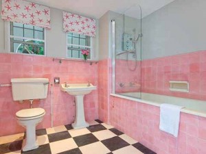 A modern shower unit complements the stylish Deco design