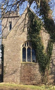 The wall under the west window re-uses a Saxon arch from the original building