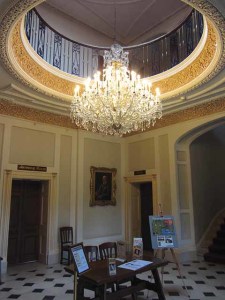 he entrance lobby at Upton House creates a suitably striking first impression. Portraits of the Llewellin family line the walls. The chandelier is not original.